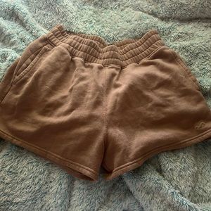 Tan high-waisted Hollister sweat shorts